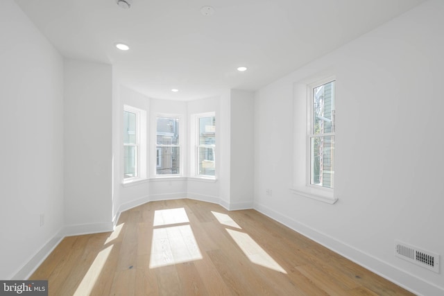 spare room with light wood-type flooring