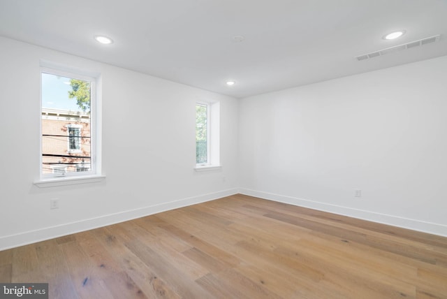 unfurnished room with light hardwood / wood-style flooring