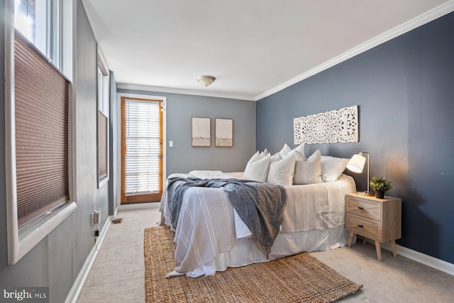 carpeted bedroom with crown molding