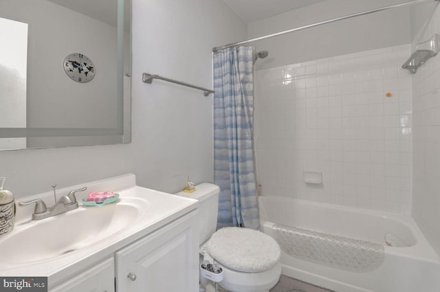 full bathroom with shower / bath combo with shower curtain, vanity, and toilet