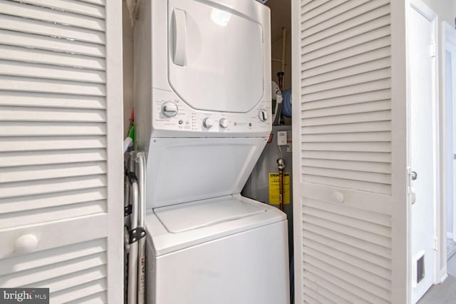 laundry room with stacked washer and clothes dryer