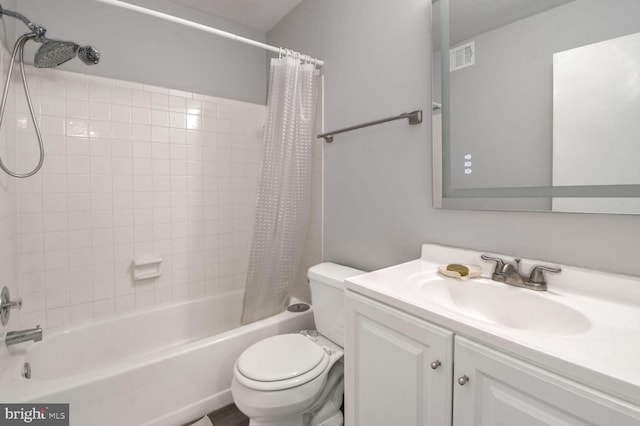 full bathroom with shower / bath combo with shower curtain, vanity, and toilet