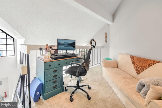 office with light colored carpet and vaulted ceiling with beams