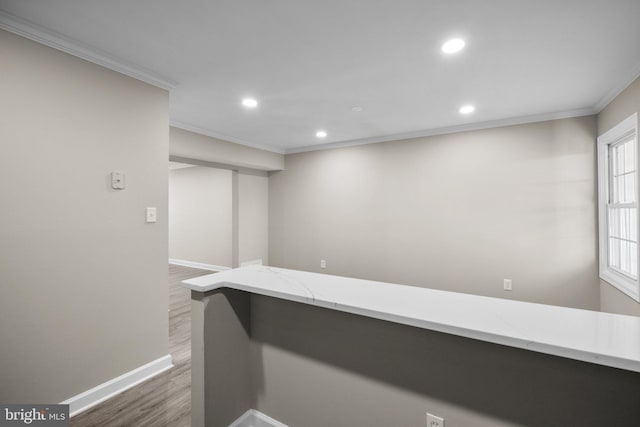 interior space featuring ornamental molding and dark hardwood / wood-style floors