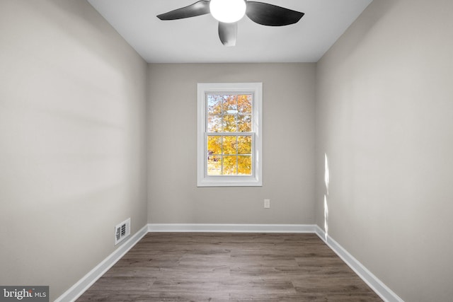 unfurnished room with hardwood / wood-style floors and ceiling fan