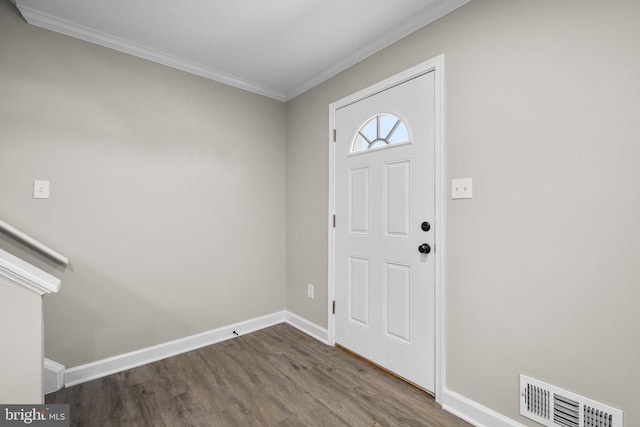 entrance foyer with wood-type flooring and crown molding