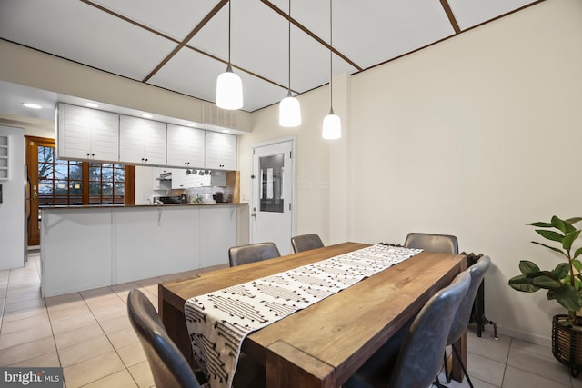 dining space featuring light tile patterned flooring