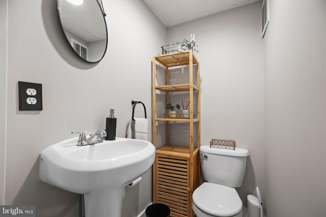 bathroom with sink and toilet