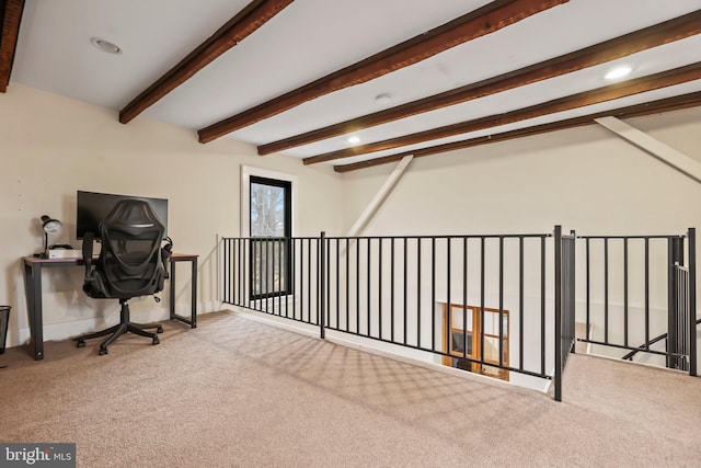 office space with light colored carpet and beam ceiling