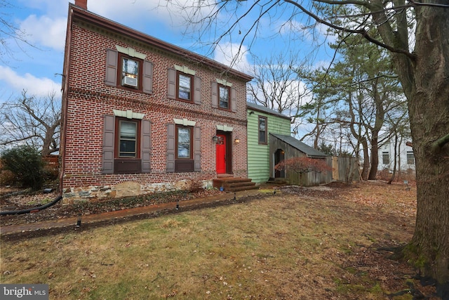 view of front of home with a front yard