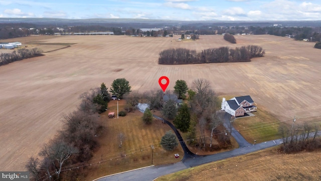 birds eye view of property featuring a rural view