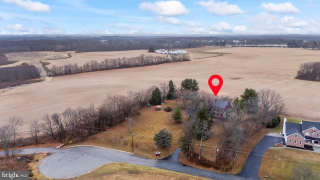 birds eye view of property featuring a rural view