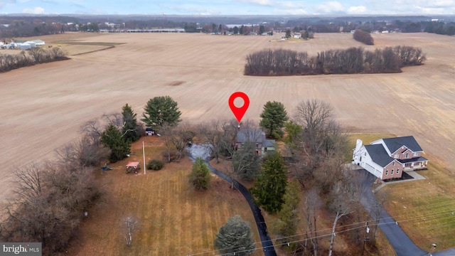 birds eye view of property featuring a rural view