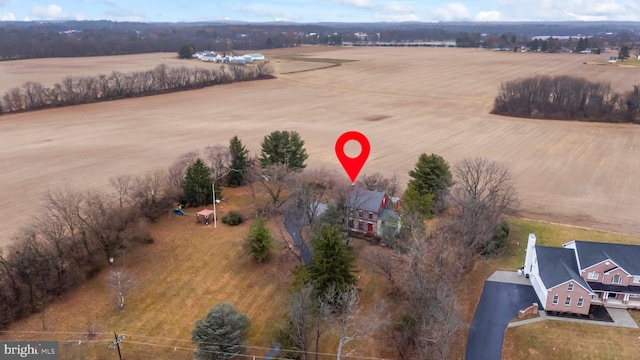 birds eye view of property with a rural view