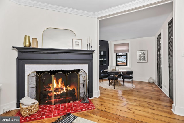 room details featuring hardwood / wood-style floors and ornamental molding