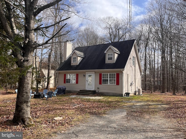 cape cod-style house with cooling unit