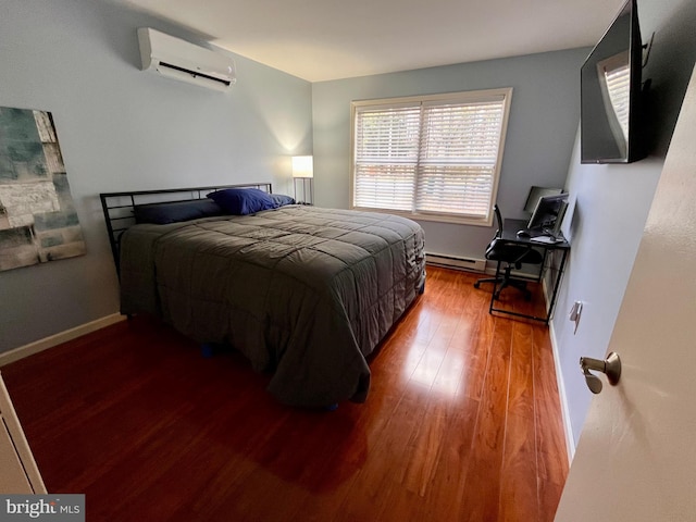 bedroom featuring a wall unit AC and hardwood / wood-style flooring