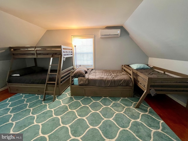 bedroom with lofted ceiling and a wall mounted air conditioner