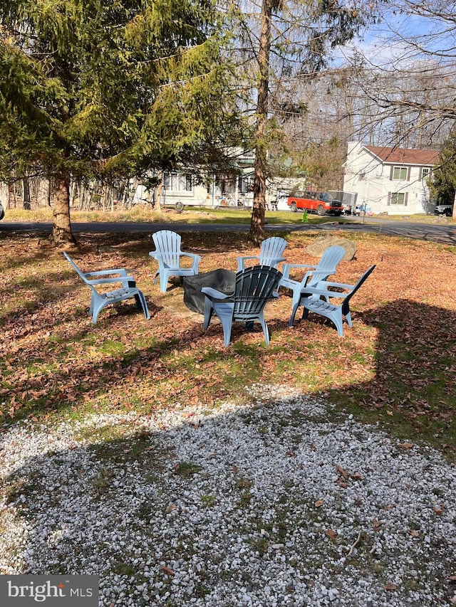 view of yard with a fire pit