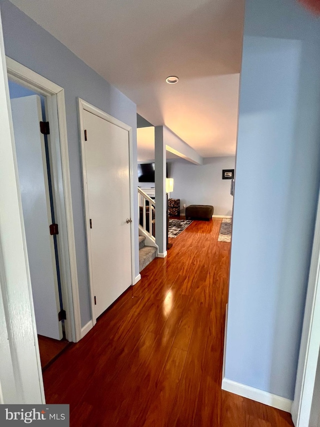 hall with hardwood / wood-style floors