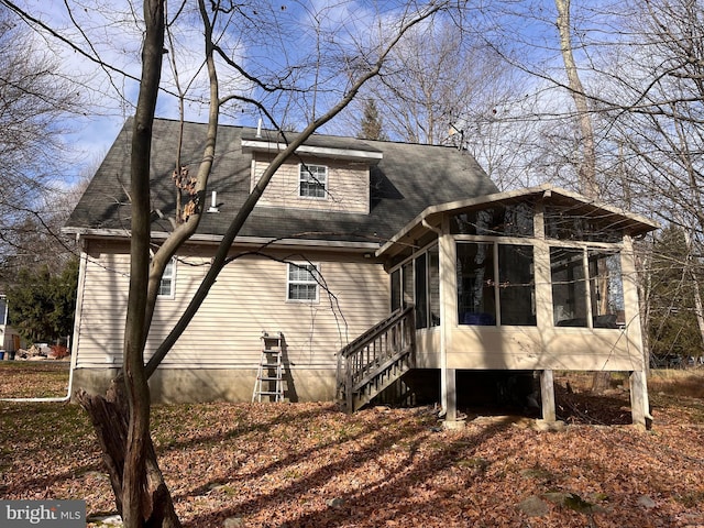 view of side of home with a sunroom