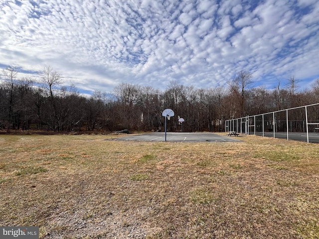 view of yard featuring basketball court