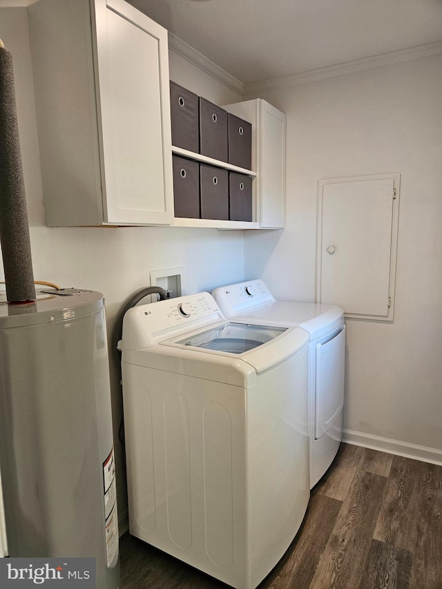 laundry room with ornamental molding, separate washer and dryer, dark hardwood / wood-style floors, water heater, and cabinets