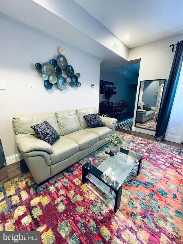 living room with dark hardwood / wood-style floors