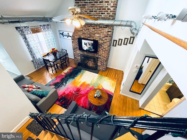 living room with hardwood / wood-style flooring and ceiling fan