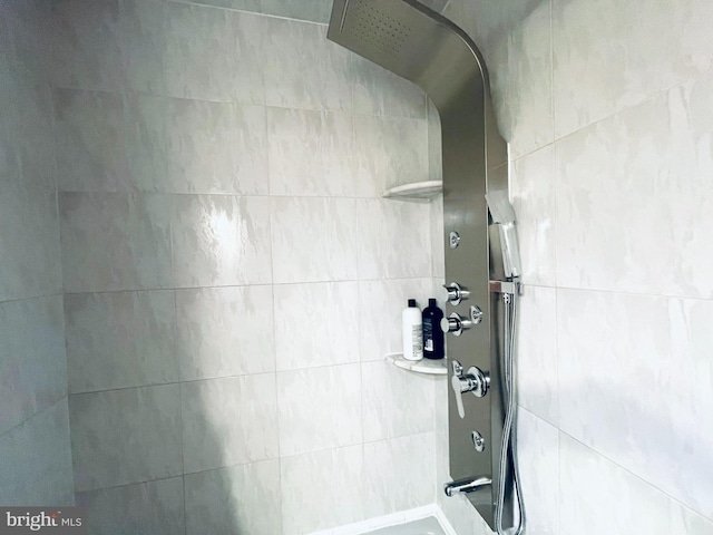 bathroom with tiled shower