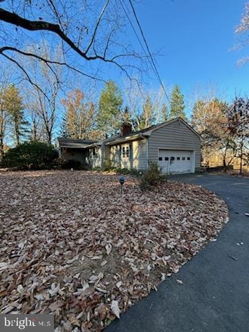 single story home with a garage