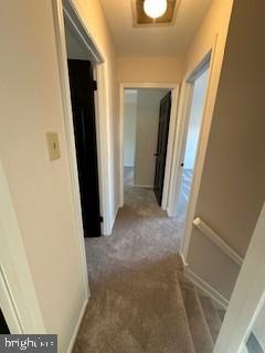 corridor with carpet flooring