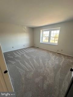 unfurnished room with carpet