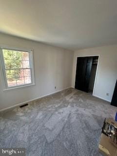 unfurnished bedroom with carpet floors