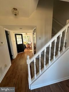 foyer entrance with dark hardwood / wood-style floors