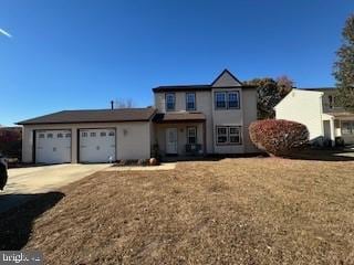 front of property with a garage