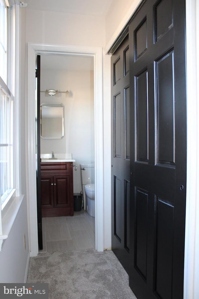 bathroom with vanity and toilet