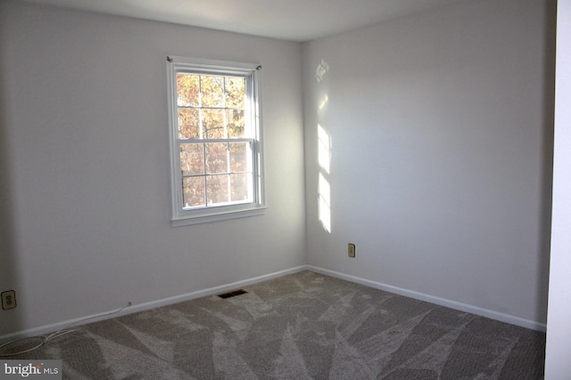 unfurnished room with carpet floors