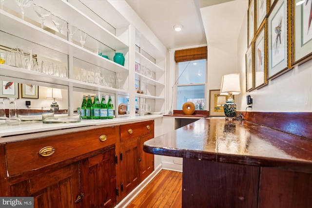 bar featuring dark hardwood / wood-style floors