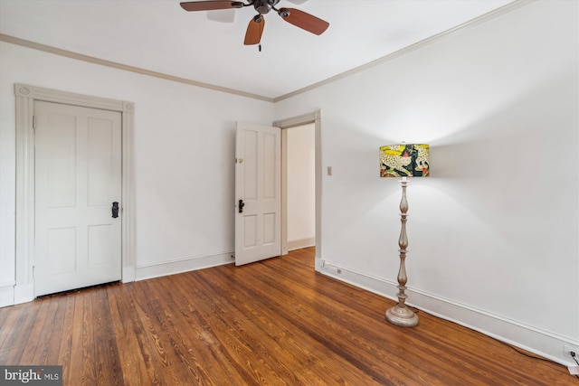 spare room featuring hardwood / wood-style flooring, ornamental molding, and ceiling fan