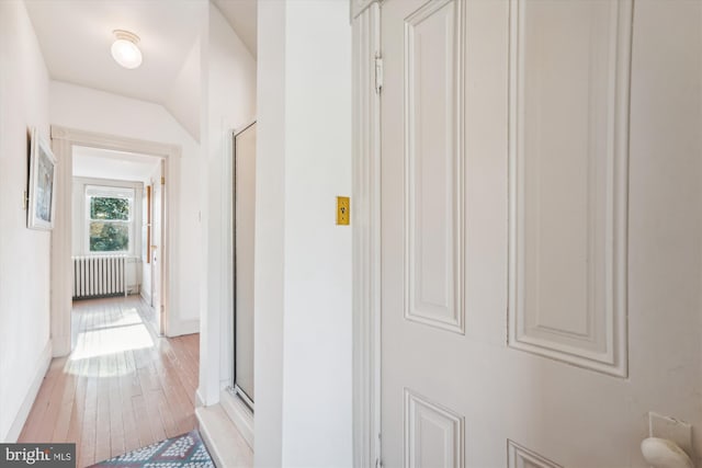 hall featuring radiator and light wood-type flooring