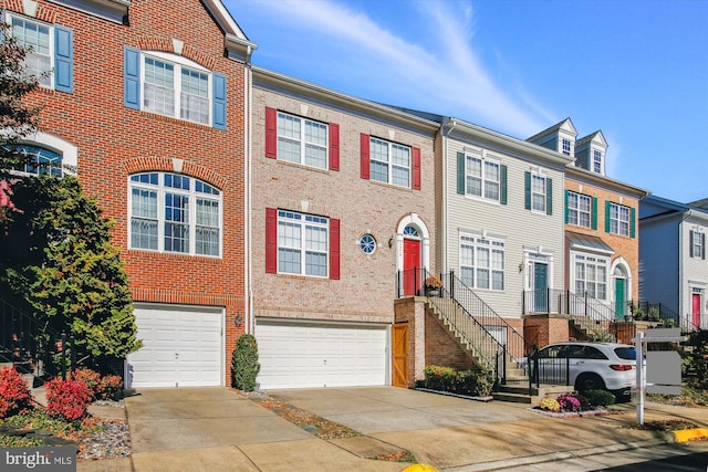 multi unit property featuring a garage