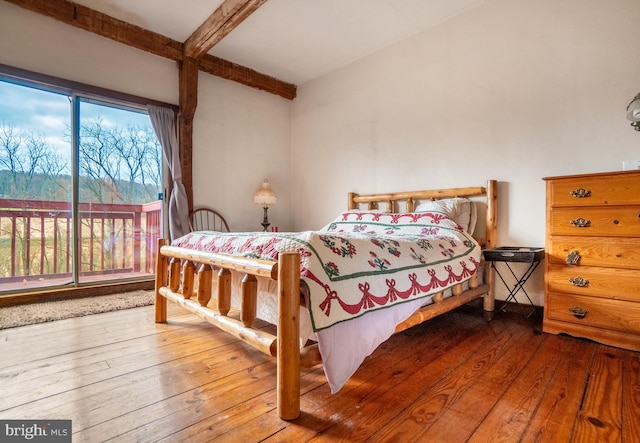 bedroom with hardwood / wood-style floors, access to exterior, and beamed ceiling