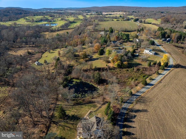 aerial overview of property's location featuring a nearby body of water and rural landscape