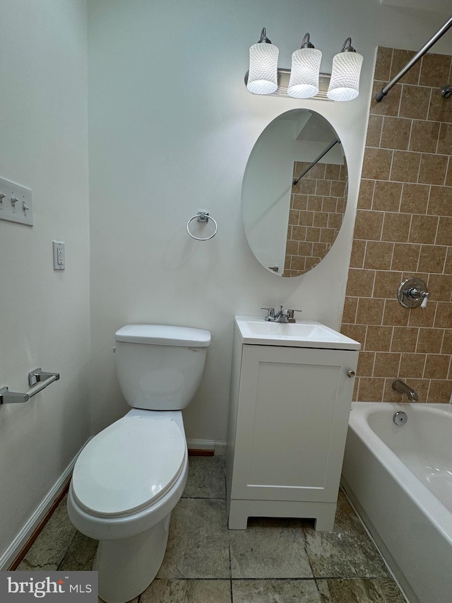 full bathroom with vanity, toilet, and tiled shower / bath combo