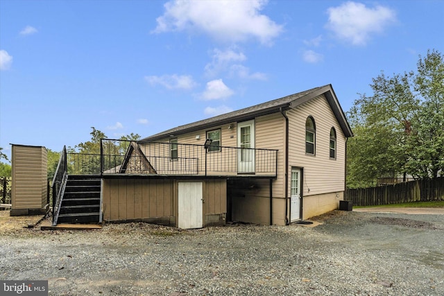 view of property exterior featuring a wooden deck and central AC