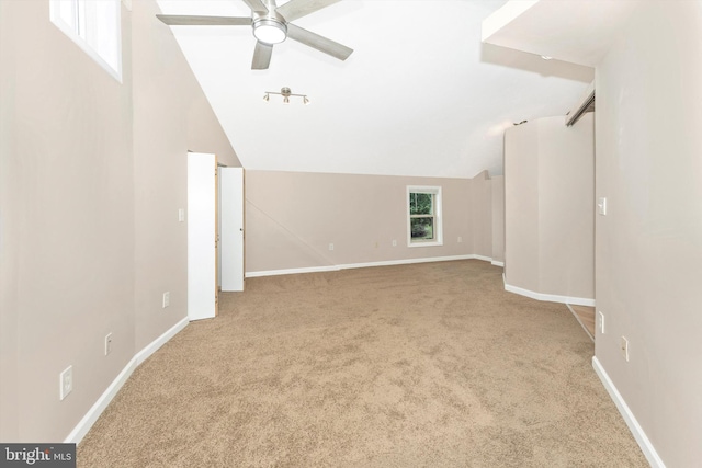 bonus room featuring light carpet, ceiling fan, and vaulted ceiling