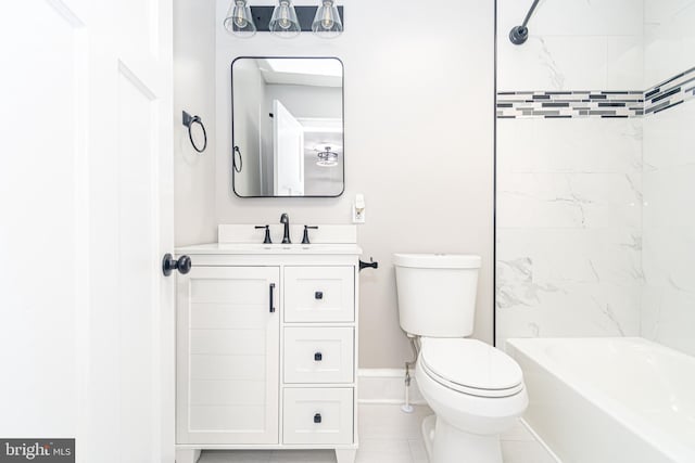 full bathroom featuring toilet, vanity, tiled shower / bath, and tile patterned floors