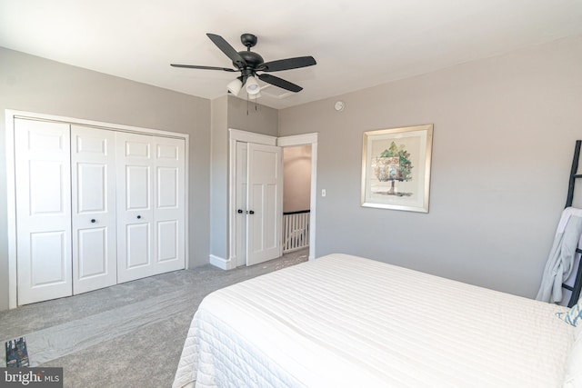 bedroom featuring ceiling fan, a closet, and light colored carpet