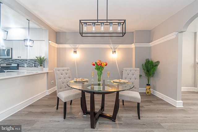 dining area with light hardwood / wood-style flooring